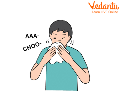 A Man Sneezing due to Cold