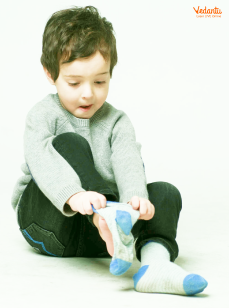 A kid, wearing her Socks