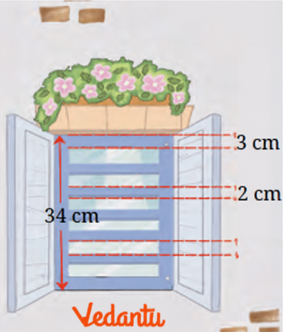 The figure shows the diagram for a window with a grill. What is the gap between the two rods in the grill?