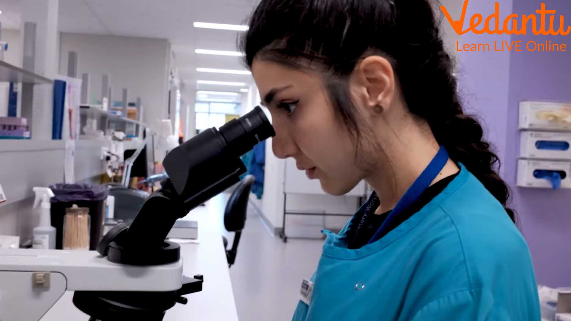 A Woman Looking into a Microscope